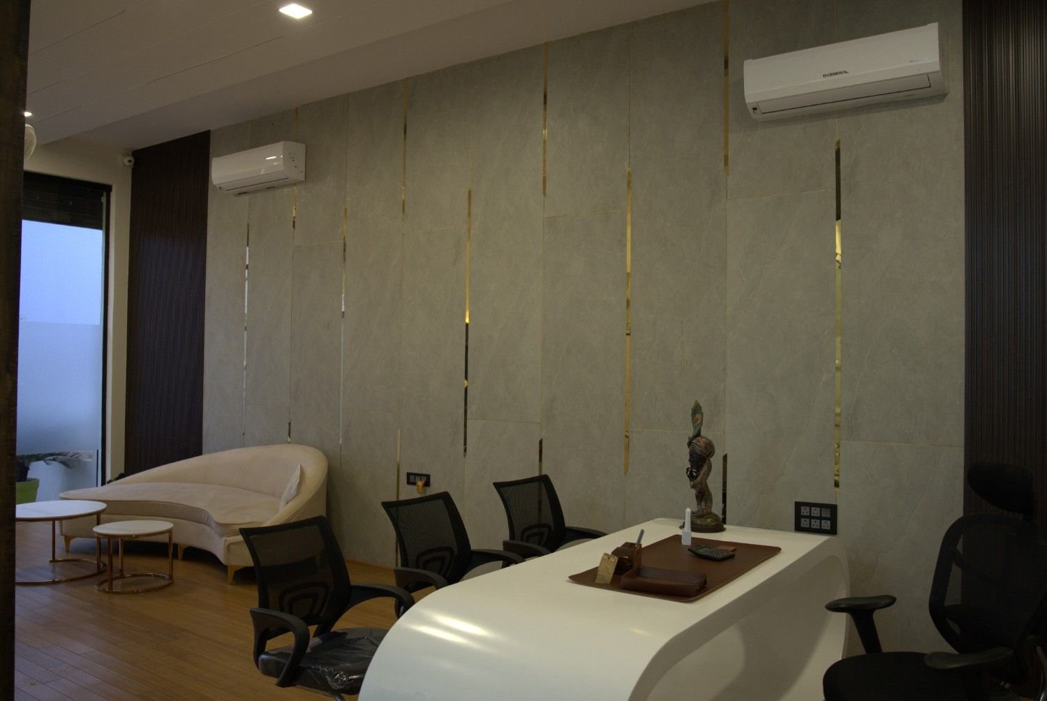 Meeting room gold strip vertical panel wall white conference table — corporate office interior Jaipur — Endless Interiors