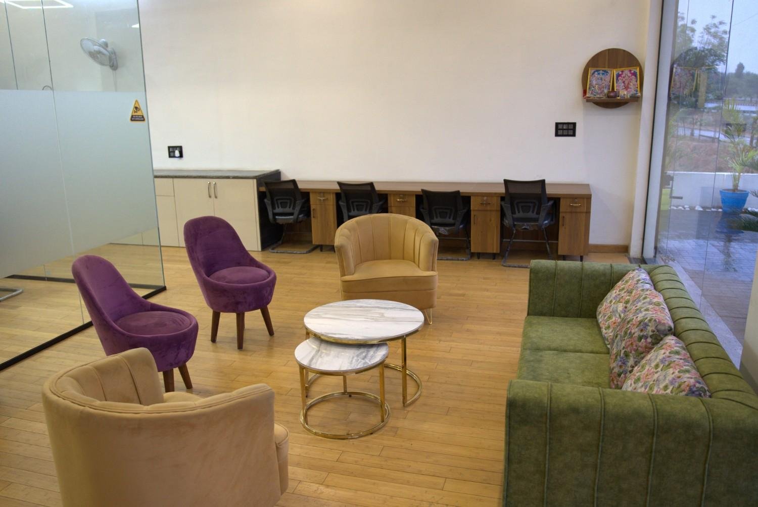 Client lounge purple beige accent chairs marble coffee table — Loanplex corporate office Jaipur — Endless Interiors