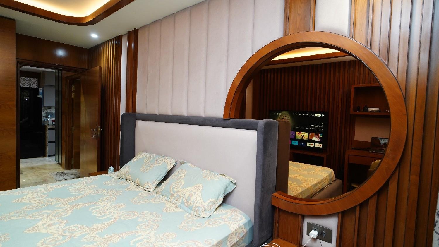 Forest green lacquered headboard bedroom — warm luxury interior Vidhyadhar Nagar Jaipur