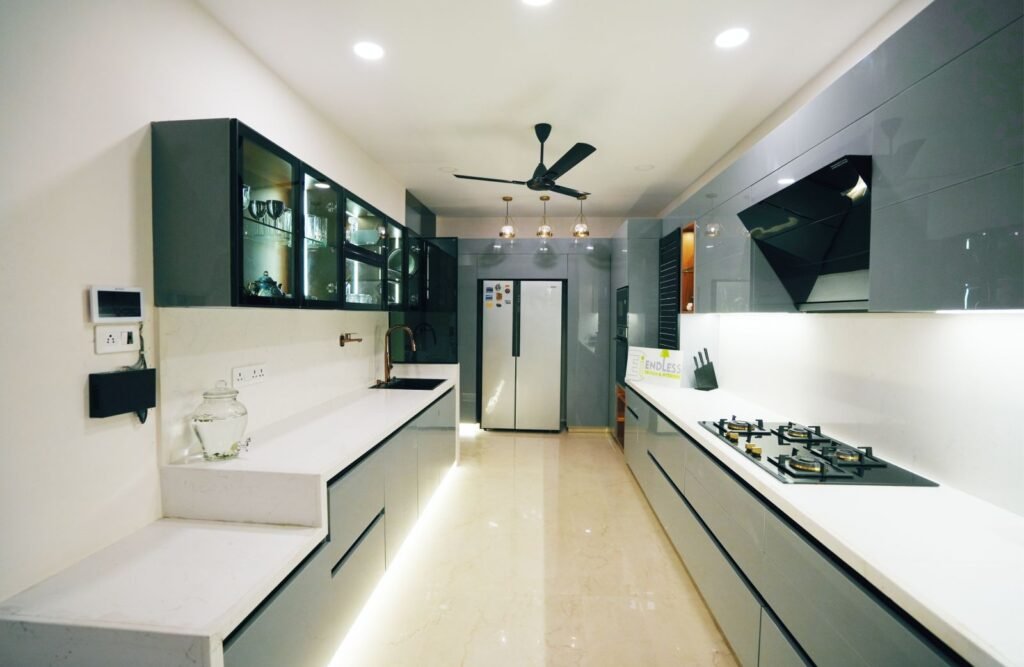 Modular kitchen storage Jaipur — high-end grey cabinetry with floor-to-ceiling storage by Endless Interior and Construction